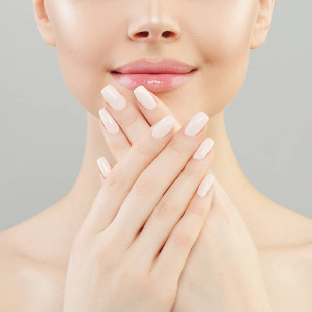 istock Manicure concept. Woman hands with white nails closeup 1151467623