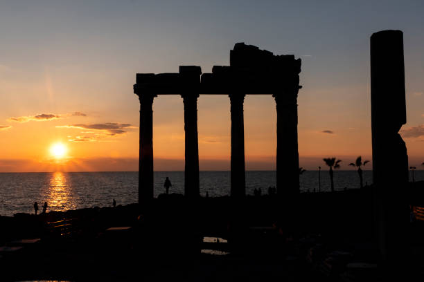 Silhouette of Temple of Apollo, Antalya Anatolia, Antalya Province, Asia, Built Structure,Sky. , Famous Place, Monument. 
Near Side, Antalya. Sunset shoots in temple, Siliüet experiments. 
One person has posed under the clan of the temple. temple of apollo antalya province stock pictures, royalty-free photos & images