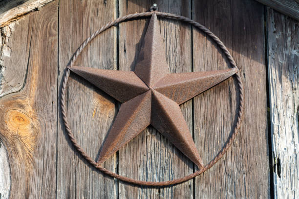 Rusty Lone Star sign on a wooden door in Texas Rusty Lone Star sign on a wooden door in Texas. dallas texas photos stock pictures, royalty-free photos & images