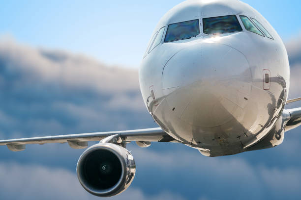 istock Airplane is flying above sky. Clouds in background. 1151479384