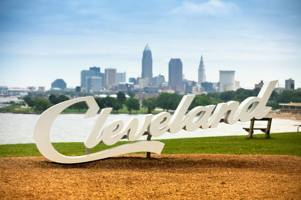 Downtown Cleveland city skyline in Ohio USA Cleveland, Ohio, USA - June 19, 2018:  The famous Cleveland sign landmark script overlooking the downtown skyline and Lake Erie Ohio USA cleveland ohio photos stock pictures, royalty-free photos & images