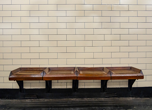 Bench and tiles wall in a subway