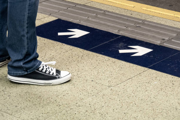 istock close up leg of man waiting for MTR subway train. 1151495973