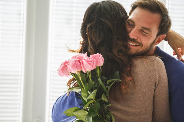 istock Romantic couple with flowers 1151496800