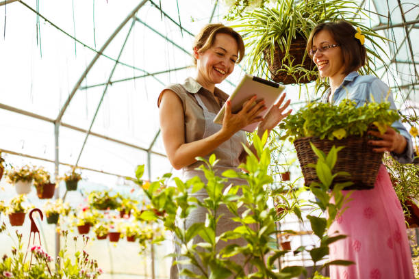 istock Garden center florist and customer 1151496833