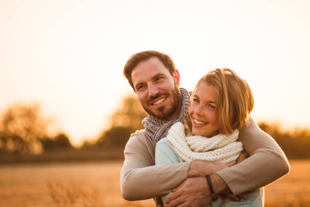 istock Loving couple hugging in field 1151496991