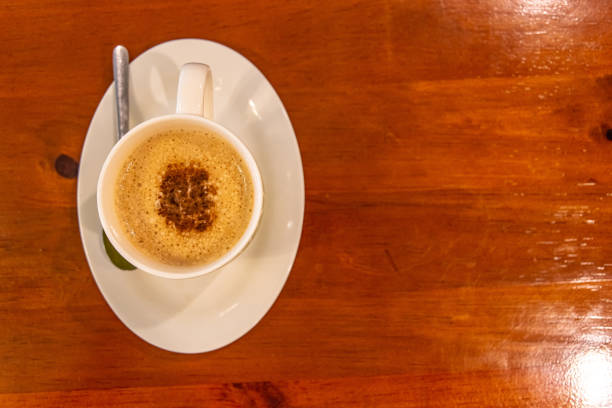 istock Cappuccino coffee on wood table 1151501609