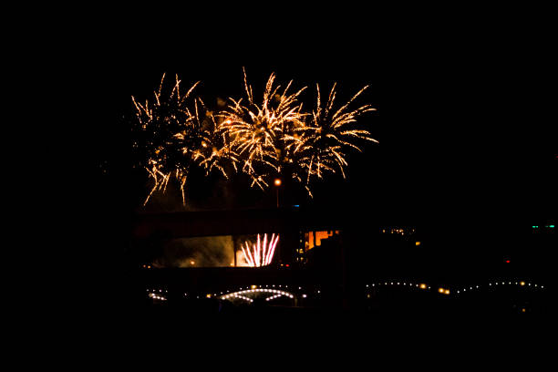 Fireworks exploding above the bridge during the 4th of July