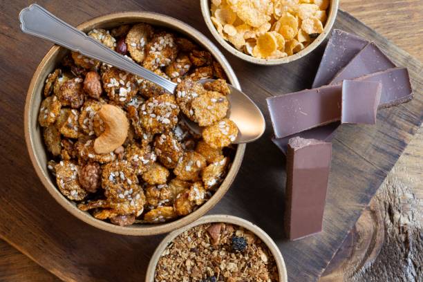 istock Bowl with granola,corn flakes and dark chocolate bar. 1151511659