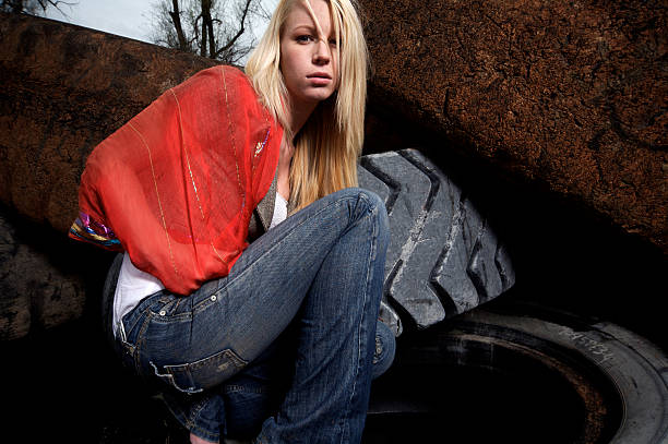 istock blonde female tire dump portraits 115151399