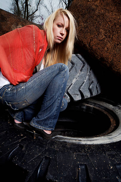 istock blonde female tire dump portraits 115151516