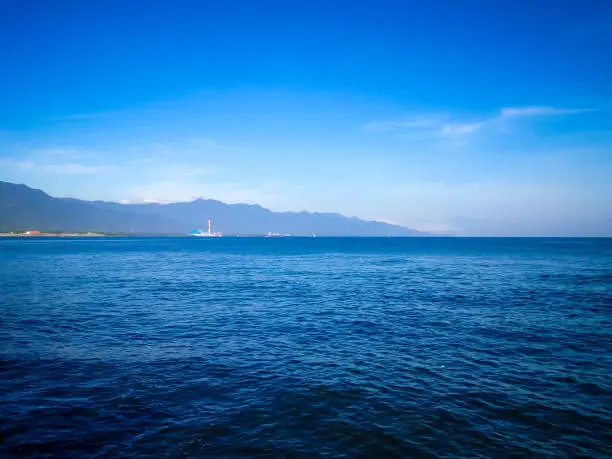 Blue Sky Tropical Beach Panorama With Calm Ocean Waves In The Morning At Umeanyar Village, North Bali, Indonesia