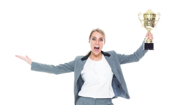 istock Businesswoman holding a trophy 1151521704
