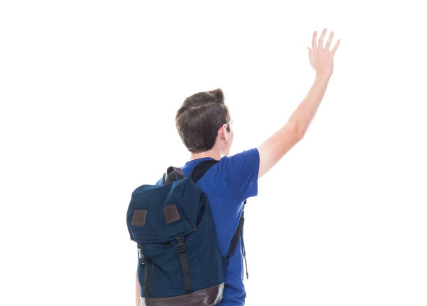istock Young high school age male student is waving 1151522932