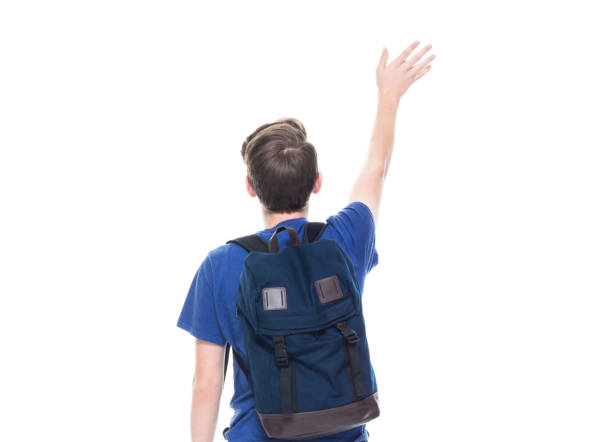 istock Young high school age male student is waving 1151522941