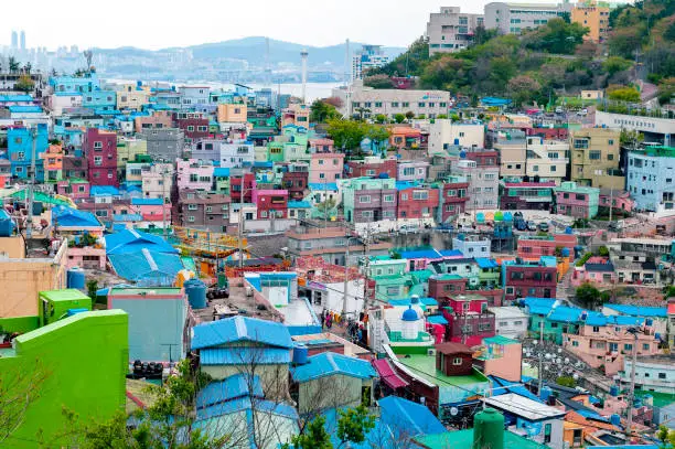 Photo of Scenic landscape of Gamcheon Culture Village, colorful and artistic tourist attraction with brightly painted houses on hillside of coastal mountain in Saha District, Busan, South Korea
