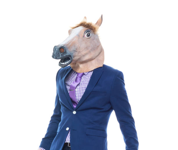istock Businessman with horse mask is dancing 1151526329