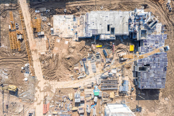 istock industrial machinery working at construction site. aerial view 1151528254