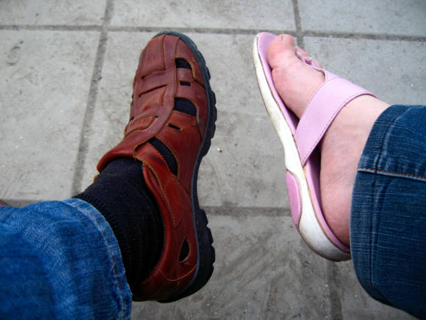 istock Mans and womsns feet playing. Together forever 1151530013
