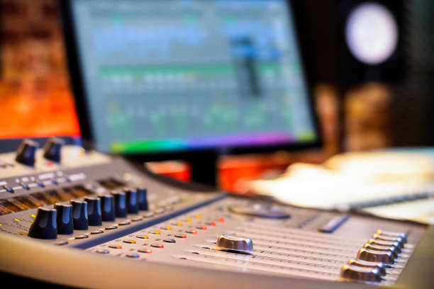 istock mixing console fader on computer monitor background in recording, broadcasting, editing studio. post production concept 1151531448