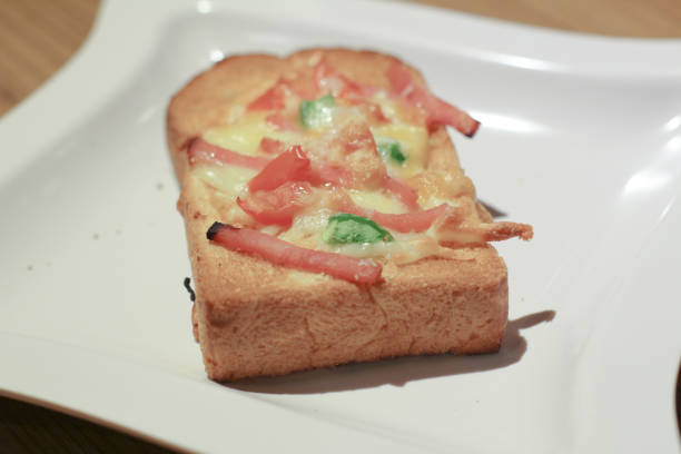 istock Pizza with  pineapple, ham, onions, cheese, tomatoes 1151531734