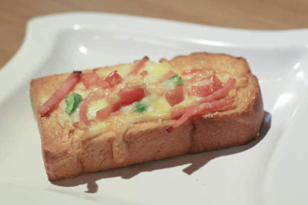 istock Pizza with  pineapple, ham, onions, cheese, tomatoes 1151531735