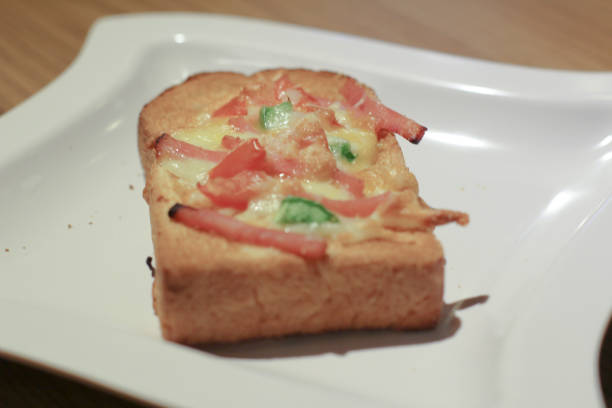 istock Pizza with  pineapple, ham, onions, cheese, tomatoes 1151531736