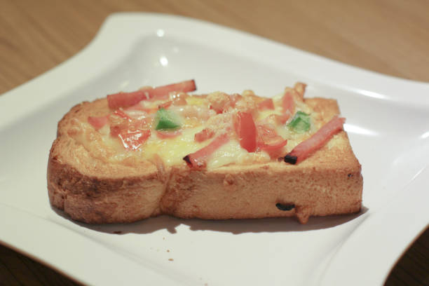 istock Pizza with  pineapple, ham, onions, cheese, tomatoes 1151531737