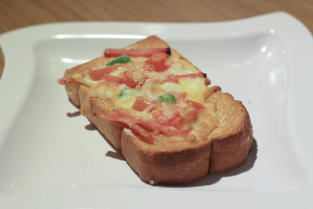 istock Pizza with  pineapple, ham, onions, cheese, tomatoes 1151531738