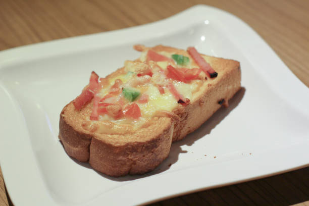 istock Pizza with  pineapple, ham, onions, cheese, tomatoes 1151531743