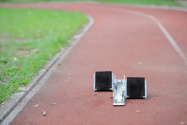Athletics Starting Blocks and red running tracks in a stadion