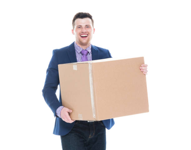 istock Businessman walking and holding a cardboard box 1151532962