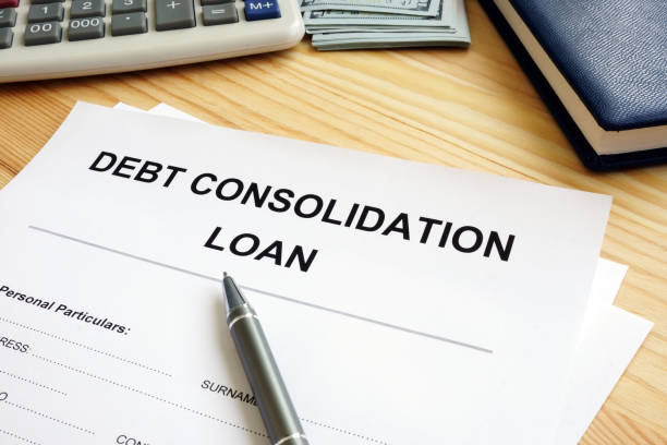 istock Debt consolidation loan concept. Stack of papers in the office. 1151539481