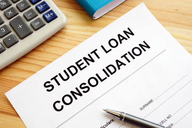 istock Student Loan Consolidation application, calculator and pen. 1151539498