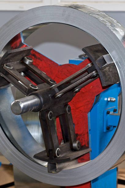 istock Thin galvanized metal tape in a roll on the drum 1151541622