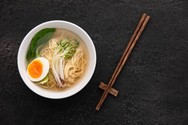 istock Asian soup noodles (ramen) with egg on dark background 1151542151