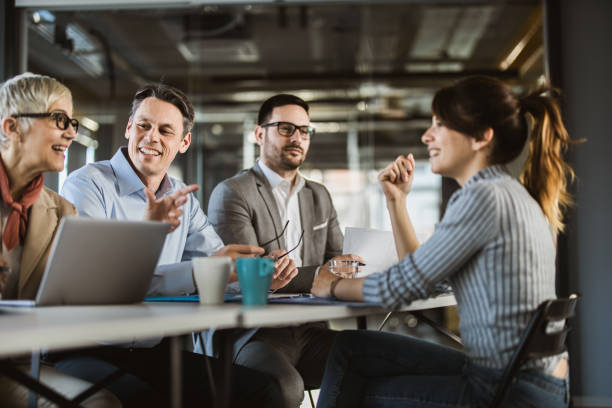 istock Happy human resource team talking to female candidate on a job interview. 1151542788