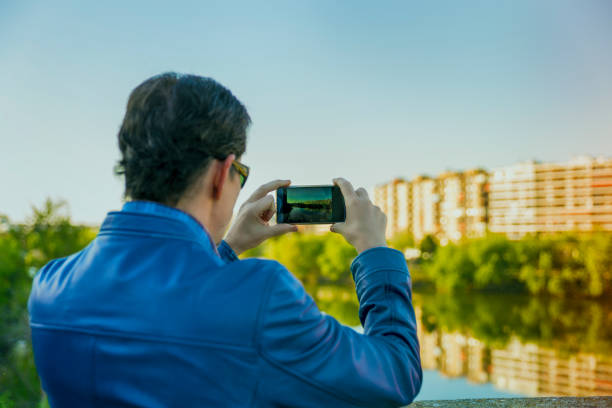 istock traveller taking photo with your smartPhone 1151544219
