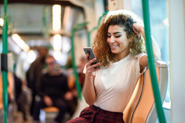 istock Arab woman inside subway train looking at her smartphone 1151549031