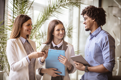 Working as a team. Business people talking at office.