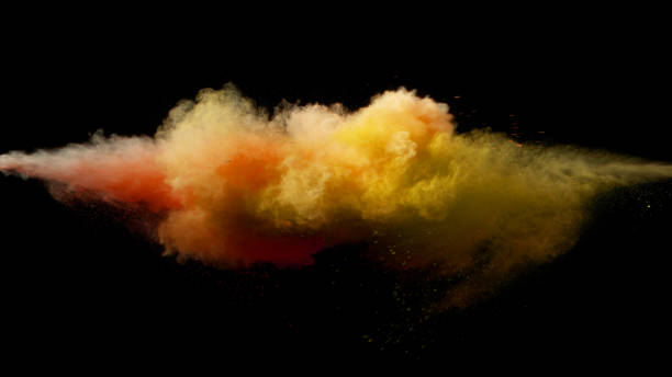 istock Collision of colored powder isolated on black 1151554256