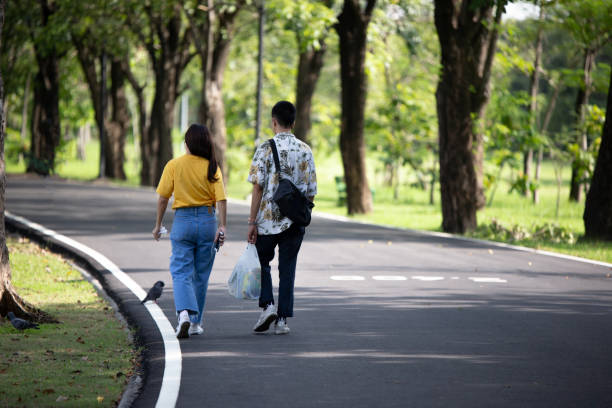 istock Rear View Of Couple Walking On Road 1151554628