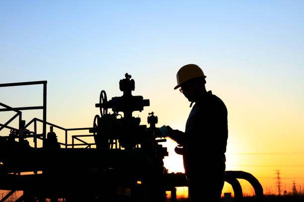 istock oil field, the oil workers are working 1151557851