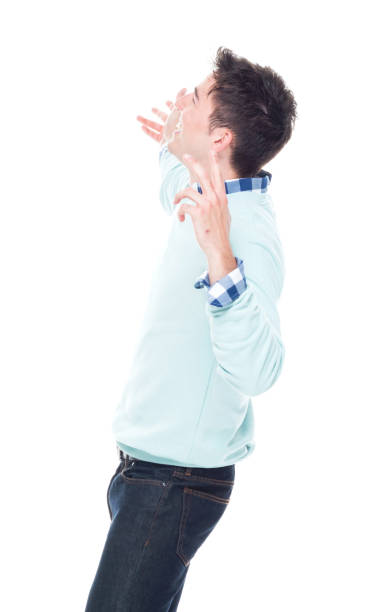 istock Handsome young man looking up in surprise 1151557996