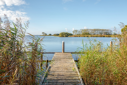 Landscape with a jetty in Terherne, Friesland, Netherlands.