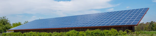 istock Panorama Solar energy plant on the field 1151562686