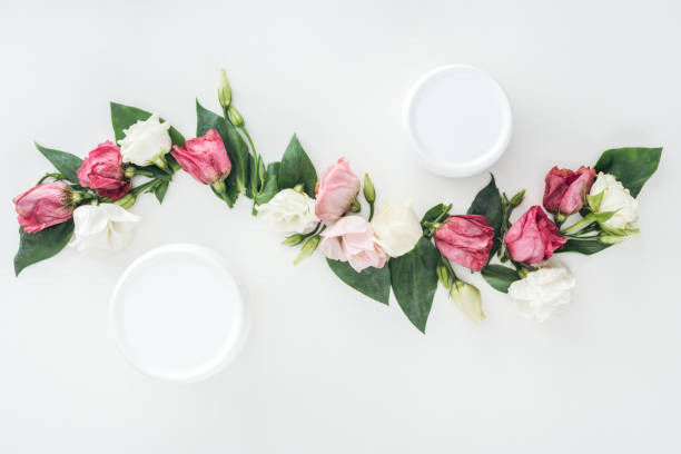 istock top view of composition eustoma and beauty cream in bottles on white background 1151562967