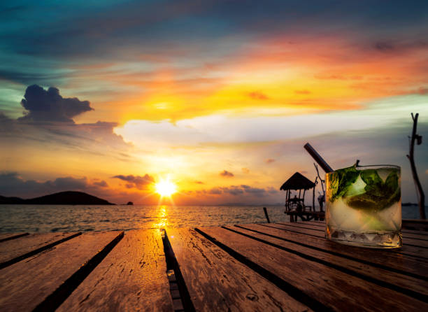 Mojito drinking with sunset in Koh Mak resort, trat, Thailand, this image can use for summer, island, travel, and party concept