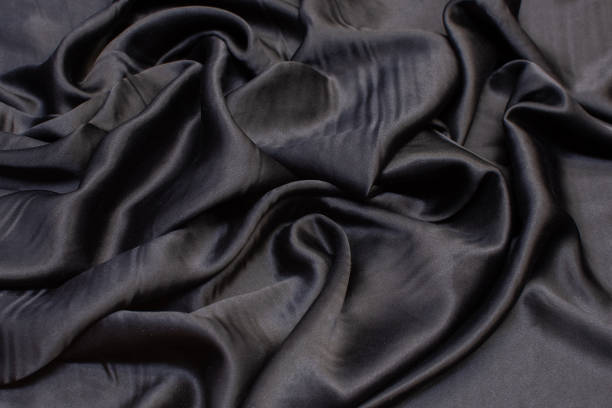 istock Silk fabric, cadi, black color in the artistic layout 1151564036