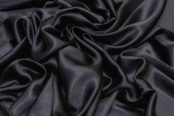 istock Silk fabric, cadi, black color in the artistic layout 1151564082